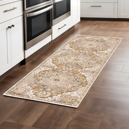 2' X 8' Gold And Ivory Oriental Power Loom Stain Resistant Runner Rug With Fringe