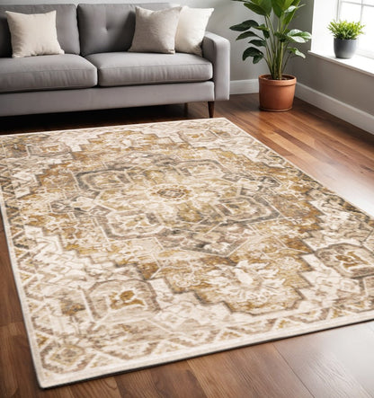 5' X 8' Gold And Ivory Oriental Power Loom Stain Resistant Area Rug With Fringe