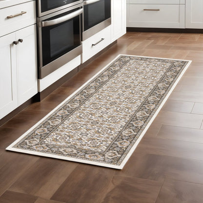 2' X 8' Ivory And Grey Oriental Power Loom Stain Resistant Runner Rug With Fringe