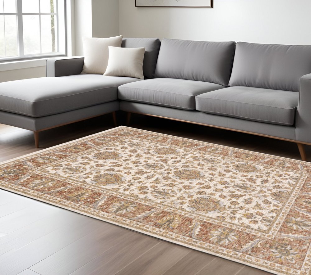 7' X 10' Ivory And Rust Oriental Area Rug With Fringe