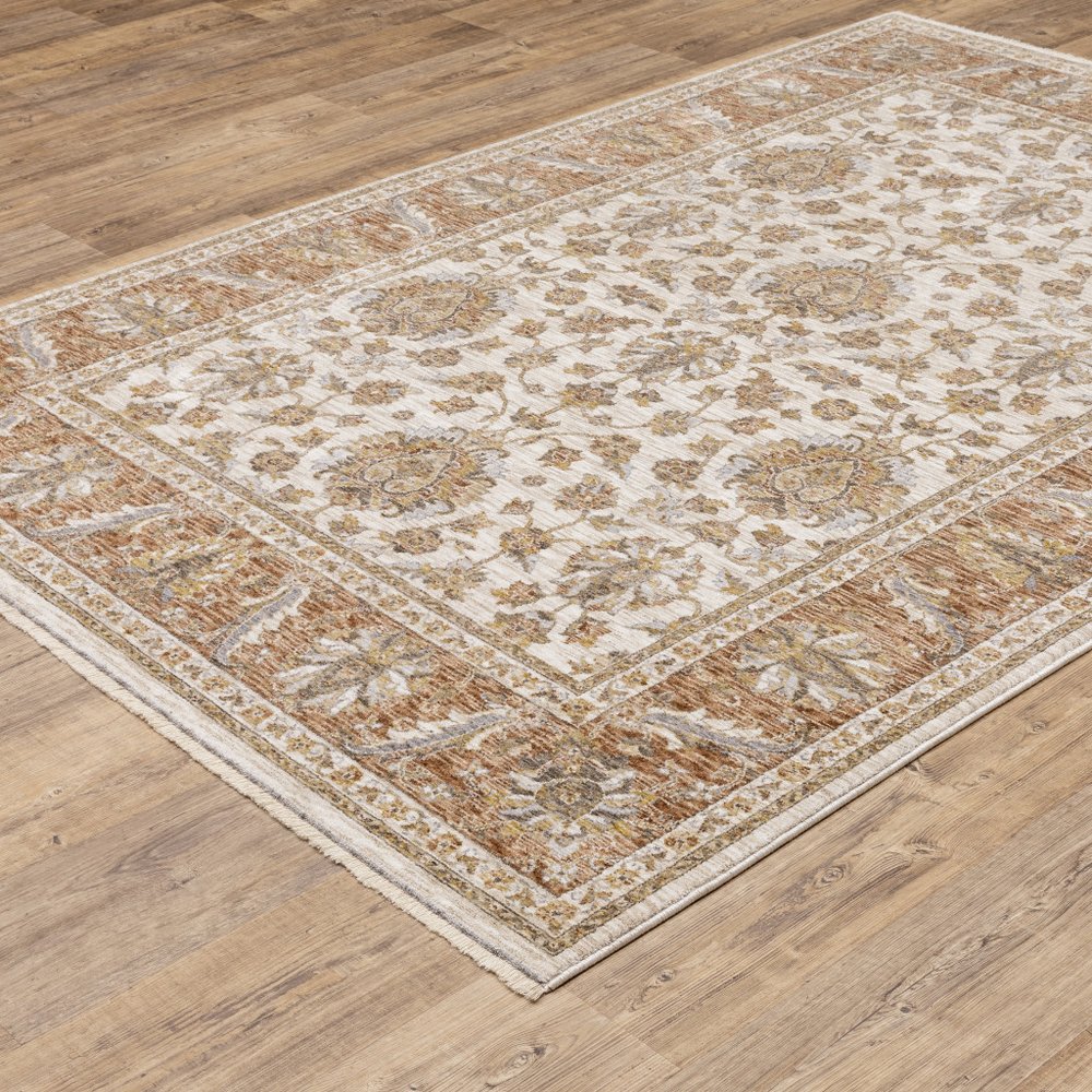 7' X 10' Ivory And Rust Oriental Area Rug With Fringe