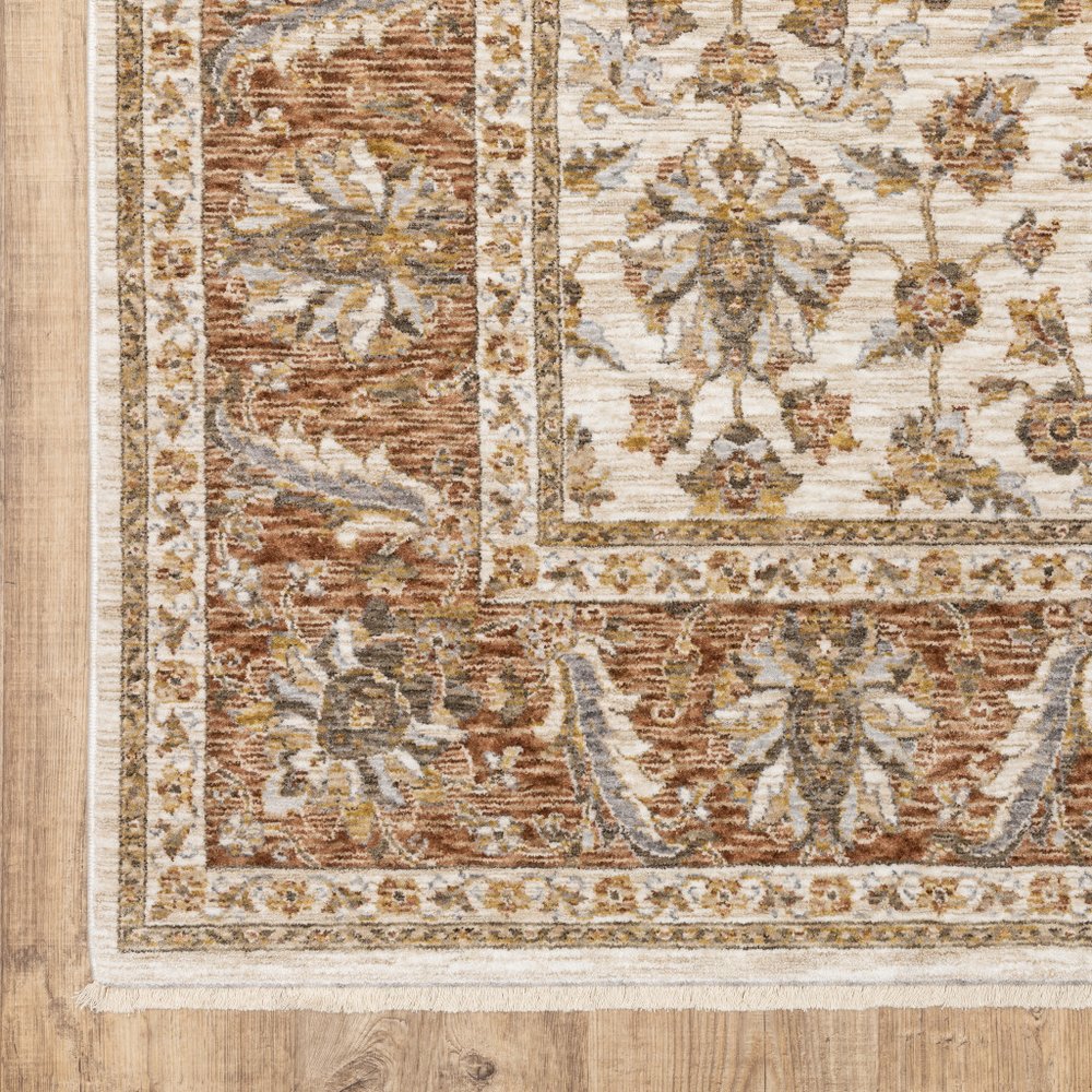 7' X 10' Ivory And Rust Oriental Area Rug With Fringe
