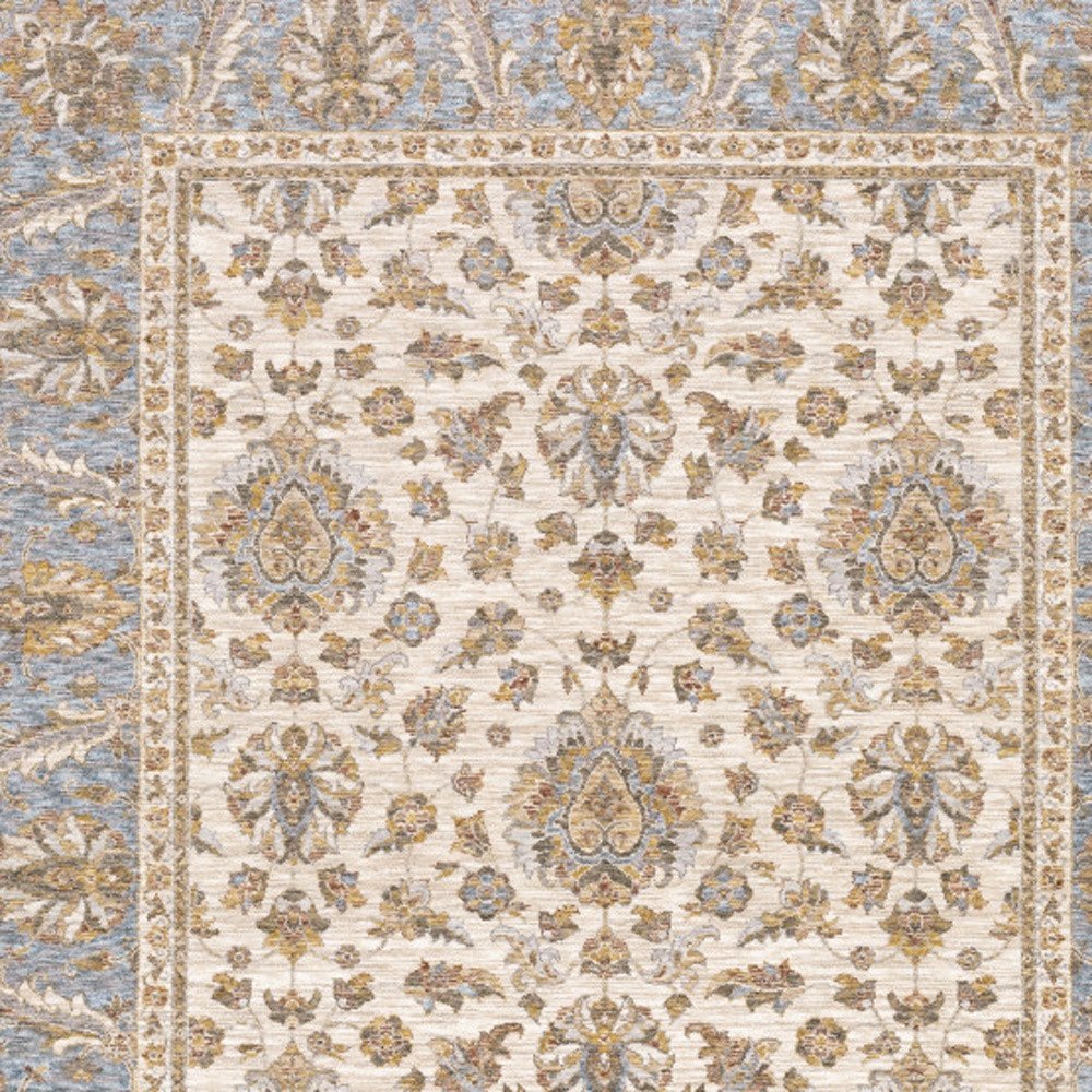 6' X 9' Ivory And Blue Oriental Power Loom Stain Resistant Area Rug With Fringe