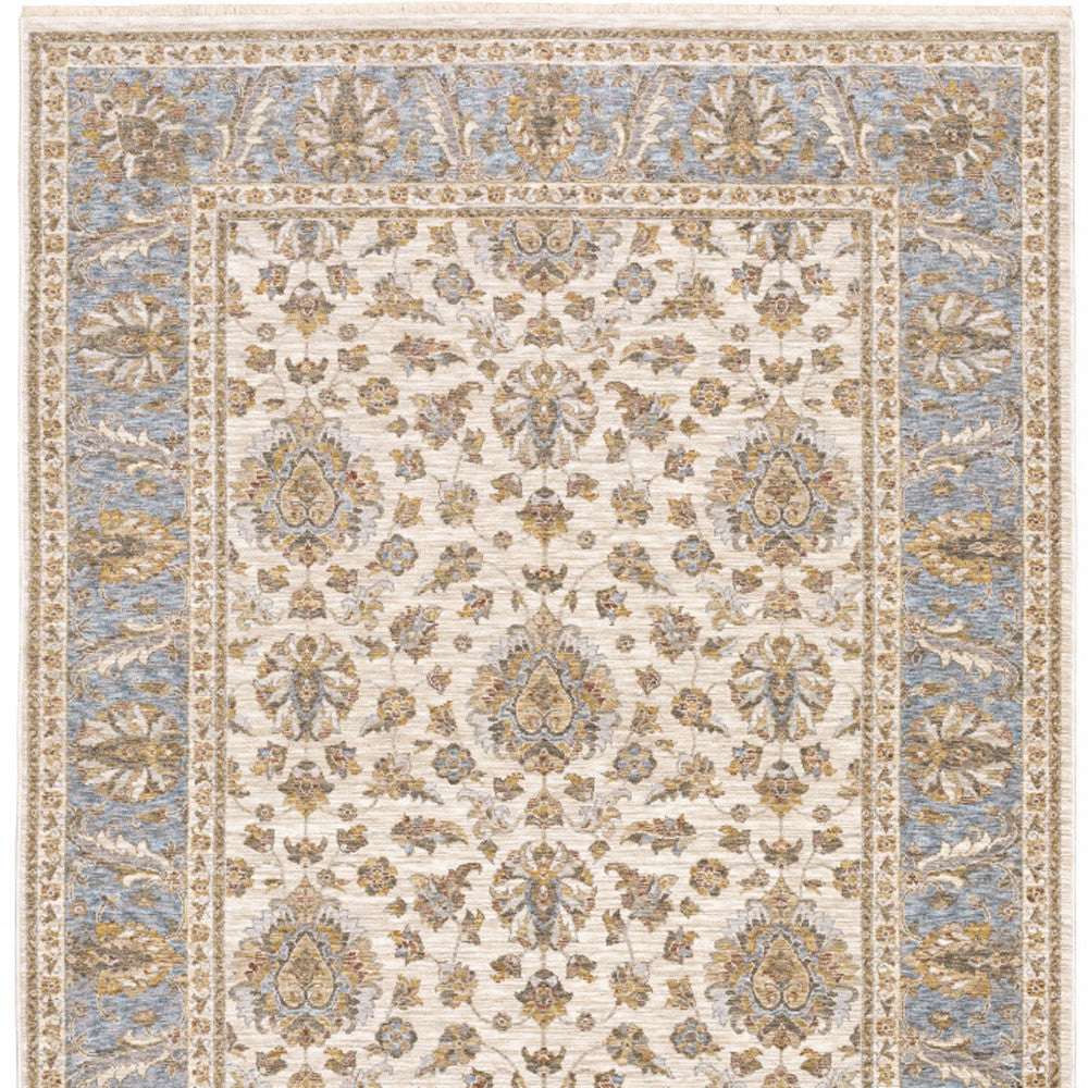 6' X 9' Ivory And Blue Oriental Power Loom Stain Resistant Area Rug With Fringe