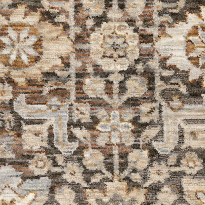 8' X 11' Charcoal Ivory and Beige Floral Power Loom Area Rug With Fringe