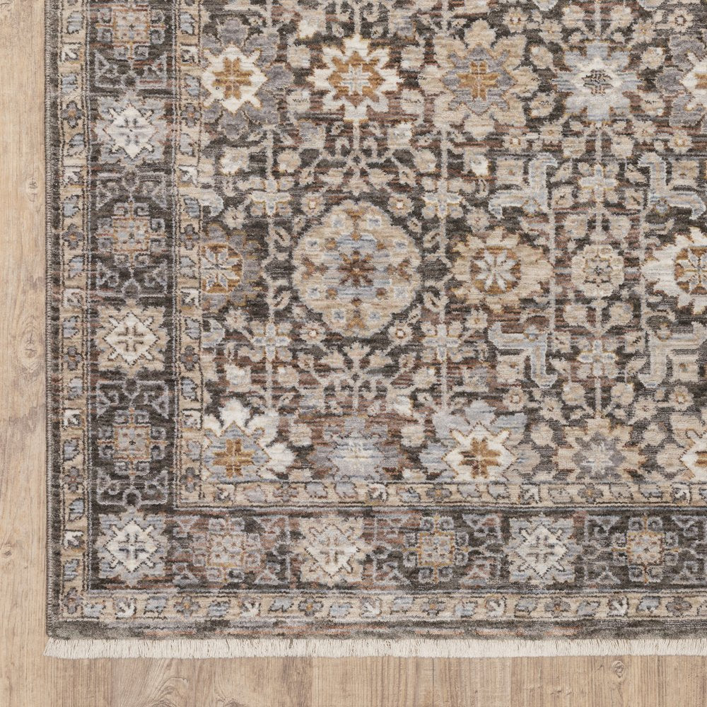 8' X 11' Charcoal Ivory and Beige Floral Power Loom Area Rug With Fringe