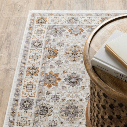 2' X 8' Ivory And Gold Oriental Power Loom Stain Resistant Runner Rug With Fringe