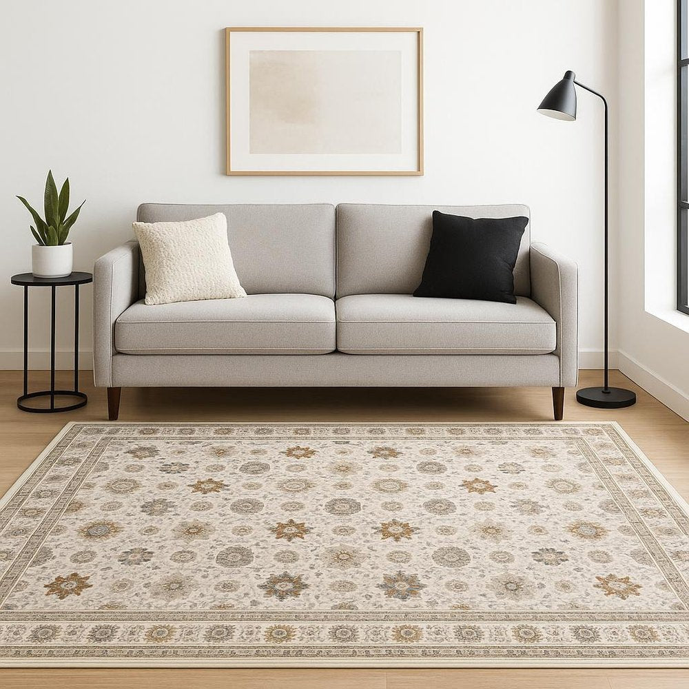 5' X 8' Ivory And Gold Oriental Power Loom Stain Resistant Area Rug With Fringe