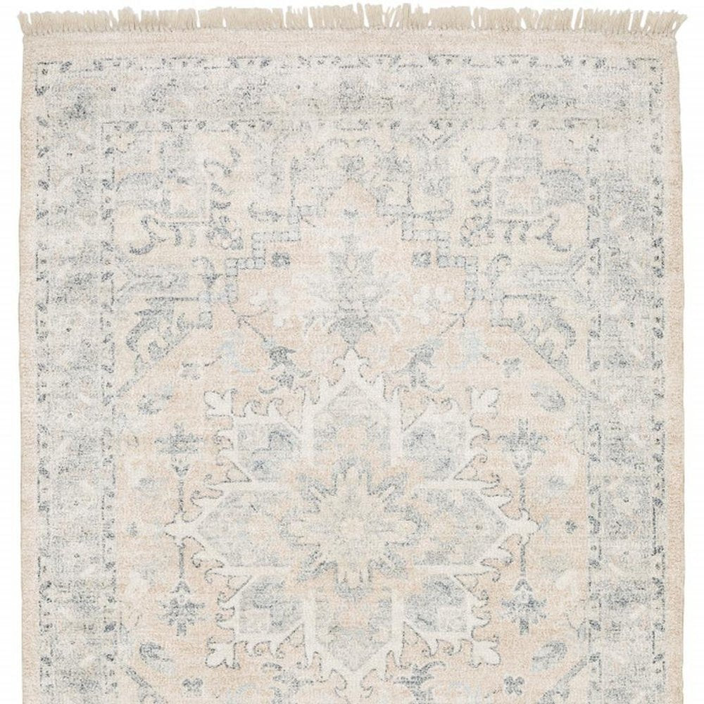 5' X 8' Beige And Grey Oriental Hand Loomed Stain Resistant Area Rug With Fringe