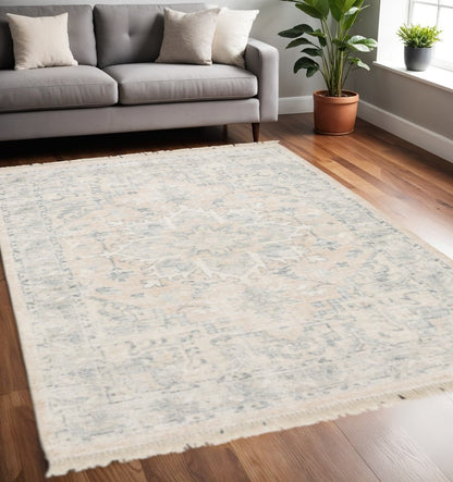 5' X 8' Beige And Grey Oriental Hand Loomed Stain Resistant Area Rug With Fringe