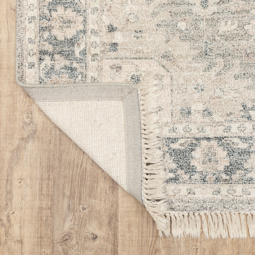 5' X 8' Beige And Grey Oriental Hand Loomed Stain Resistant Area Rug With Fringe