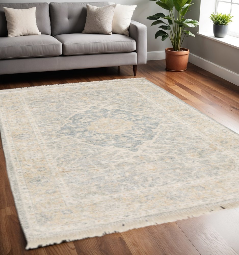 5' X 8' Grey And Beige Oriental Hand Loomed Stain Resistant Area Rug With Fringe