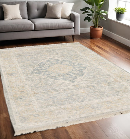 5' X 8' Grey And Beige Oriental Hand Loomed Stain Resistant Area Rug With Fringe