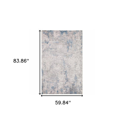 5' X 7' Grey And Blue Abstract Power Loom Stain Resistant Area Rug