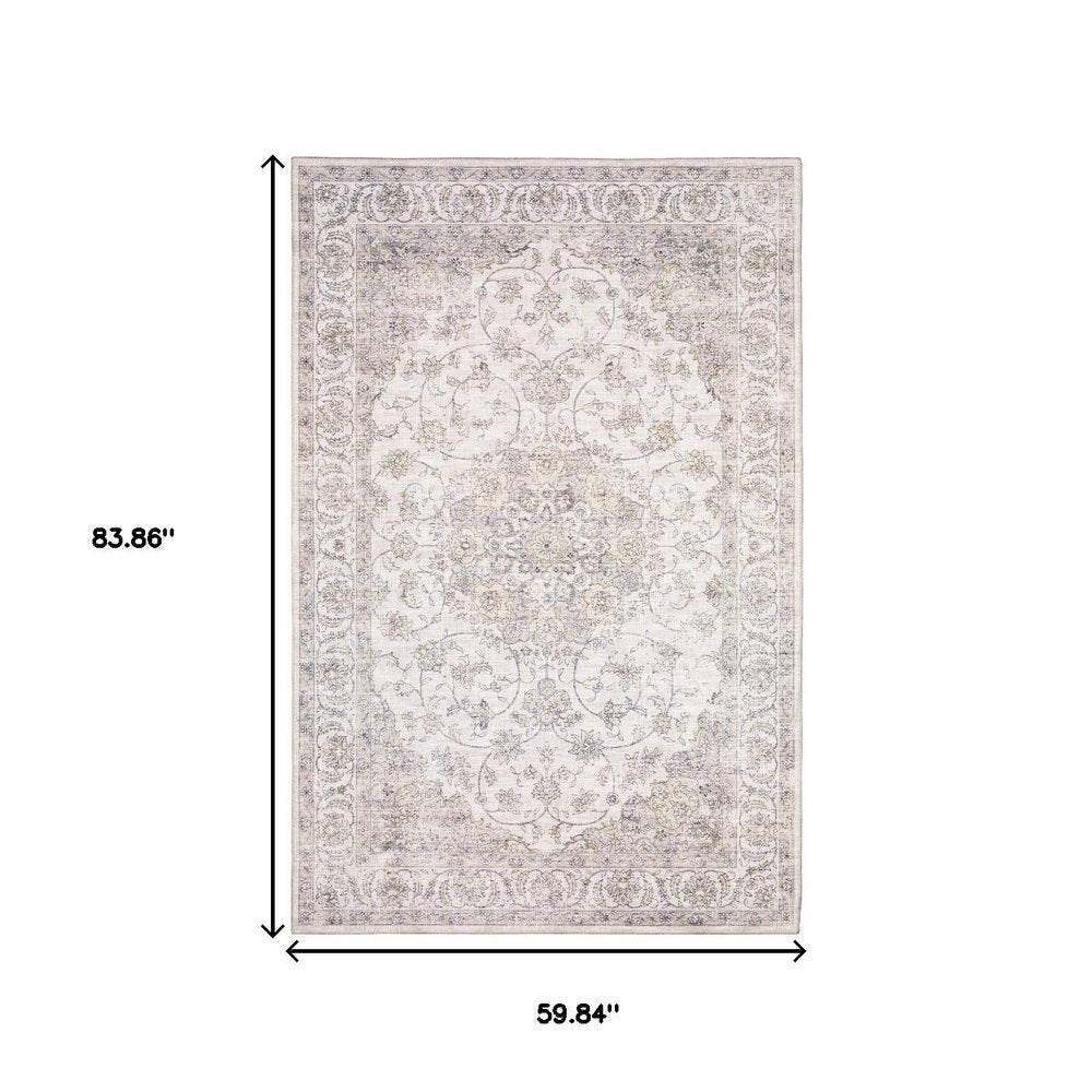 5' X 7' Beige Gold And Grey Oriental Power Loom Stain Resistant Area Rug