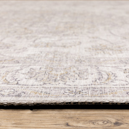 5' X 7' Beige Gold And Grey Oriental Power Loom Stain Resistant Area Rug