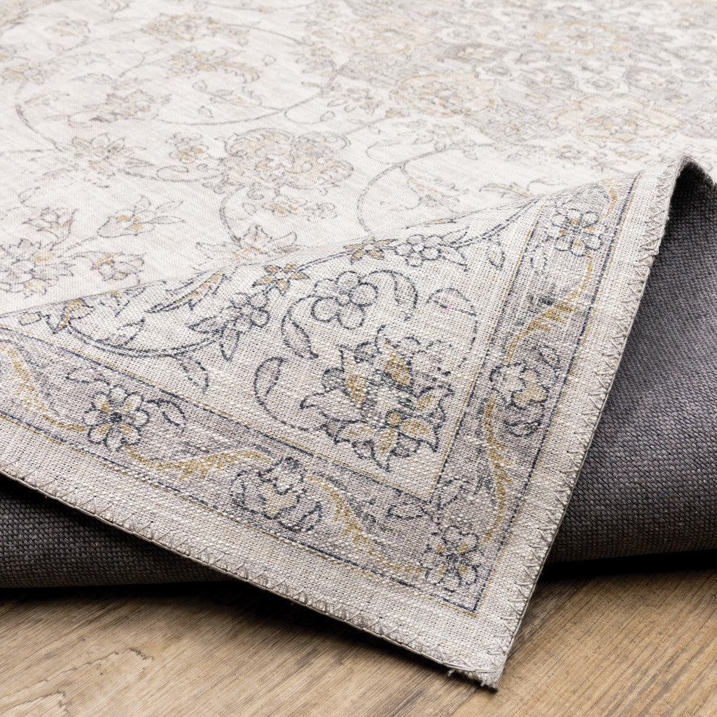 5' X 7' Beige Gold And Grey Oriental Power Loom Stain Resistant Area Rug