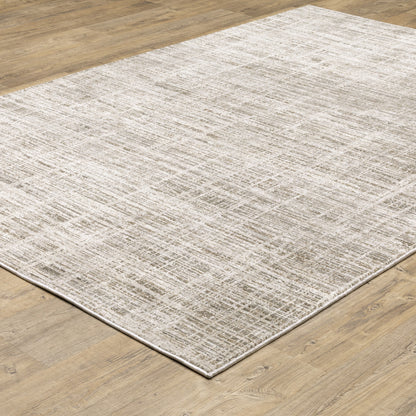 3' X 5' Beige Grey Ivory Tan And Brown Abstract Power Loom Stain Resistant Area Rug