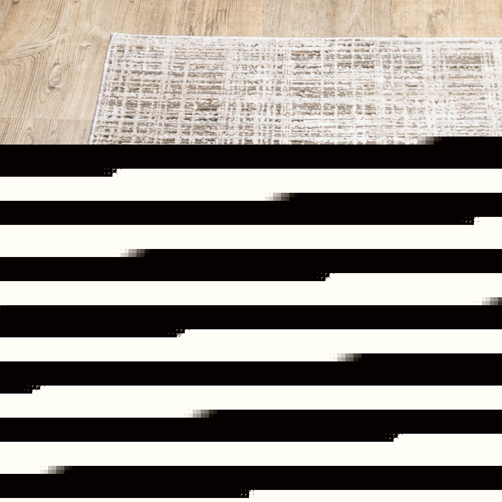 5' X 8' Beige Grey Ivory Tan And Brown Abstract Power Loom Stain Resistant Area Rug