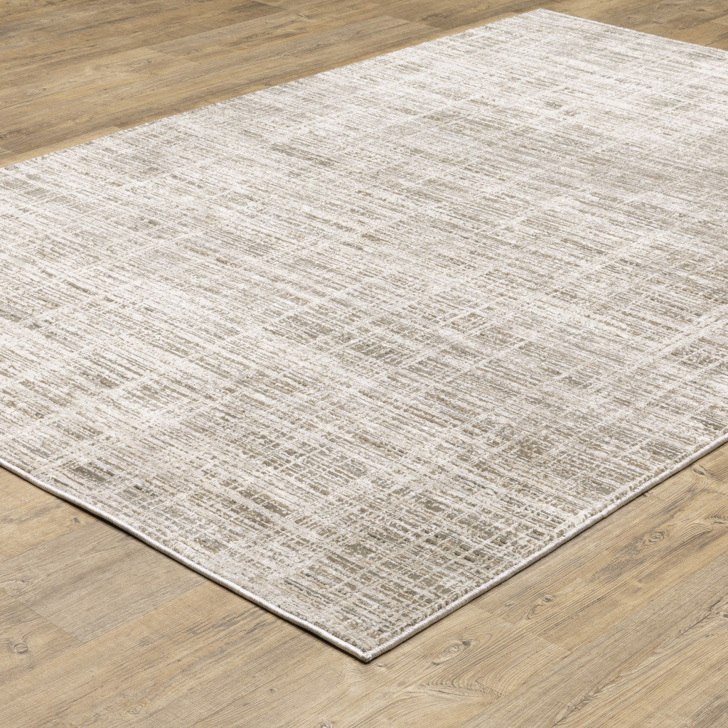 6' X 9' Beige Grey Ivory Tan And Brown Abstract Power Loom Stain Resistant Area Rug