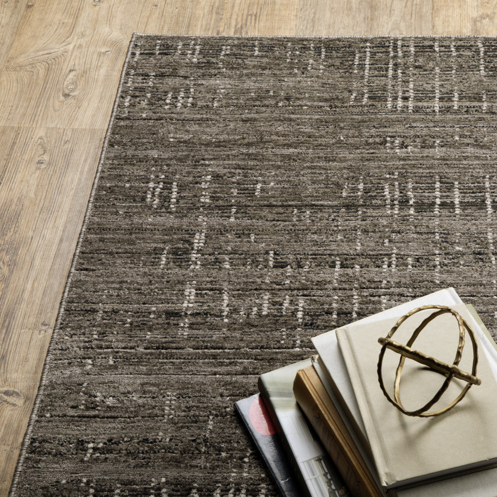 2' X 8' Charcoal Grey Grey Ivory Tan And Brown Abstract Power Loom Stain Resistant Runner Rug