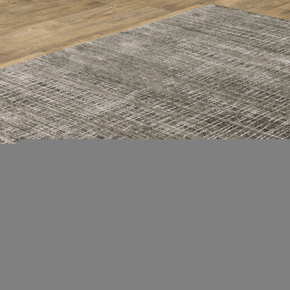 5' X 8' Charcoal Grey Grey Ivory Tan And Brown Abstract Power Loom Stain Resistant Area Rug