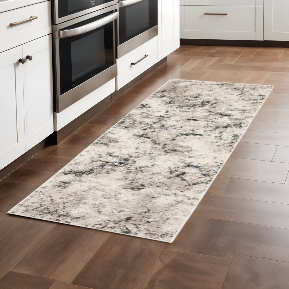 2' X 8' Ivory Grey Black Beige And Tan Abstract Power Loom Stain Resistant Runner Rug