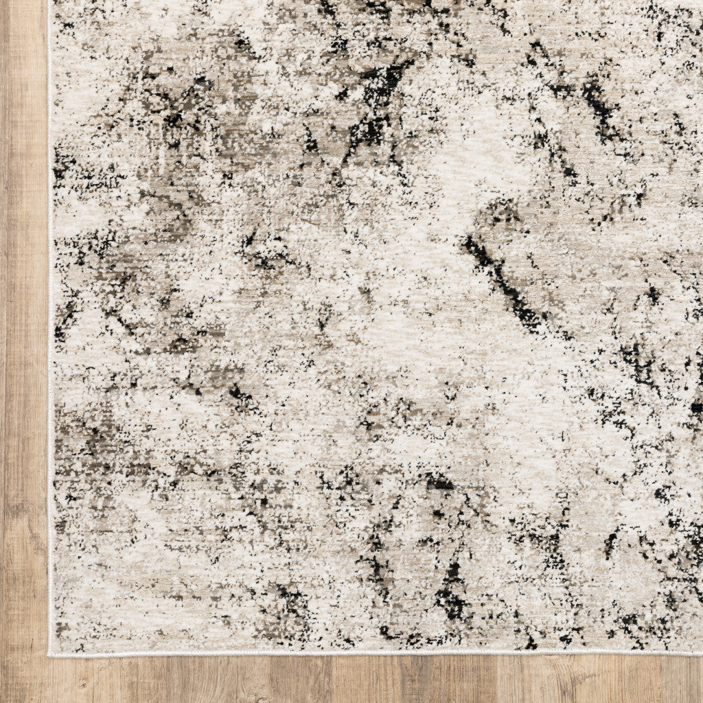 2' X 8' Ivory Grey Black Beige And Tan Abstract Power Loom Stain Resistant Runner Rug