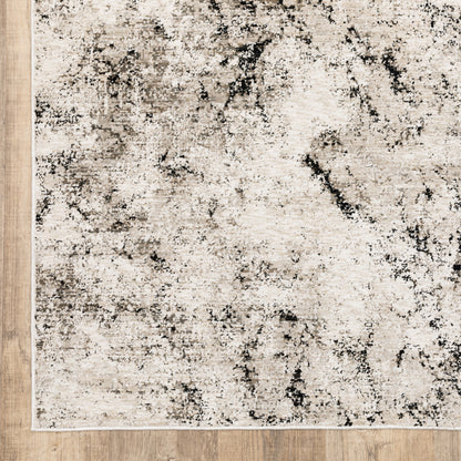 6' X 9' Ivory Grey Black Beige And Tan Abstract Power Loom Stain Resistant Area Rug