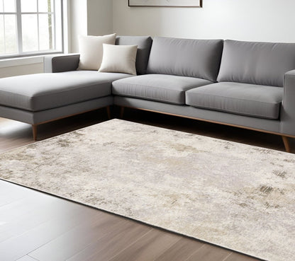 8' X 11' Ivory And Beige Abstract Distressed Area Rug