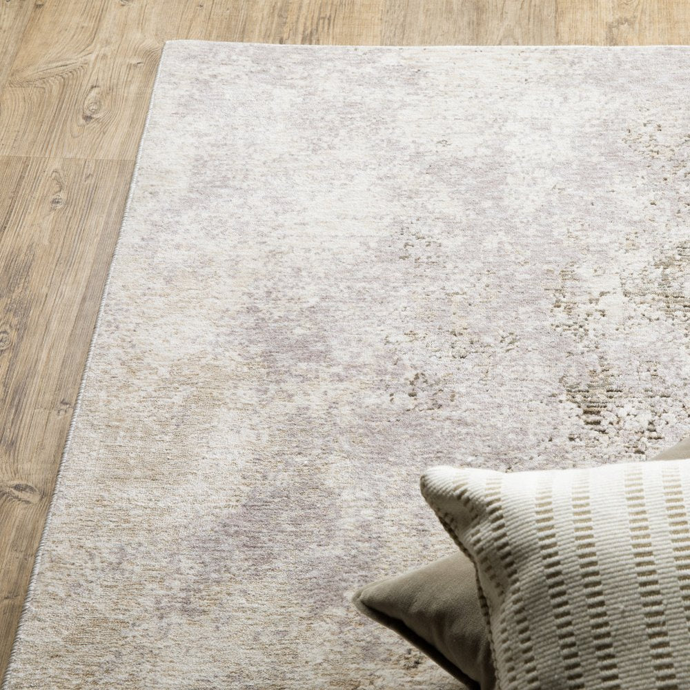 8' X 11' Ivory And Beige Abstract Distressed Area Rug