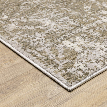 5' X 8' Ivory Grey Tan Brown And Beige Abstract Power Loom Stain Resistant Area Rug