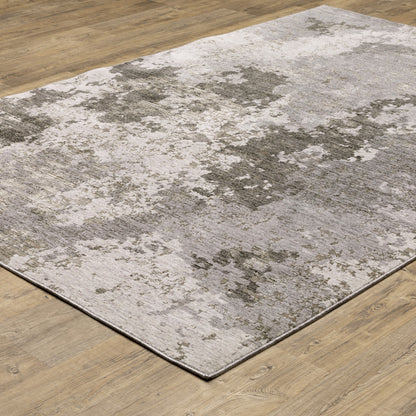 5' X 8' Grey Ivory Beige Tan Brown And Black Abstract Power Loom Stain Resistant Area Rug