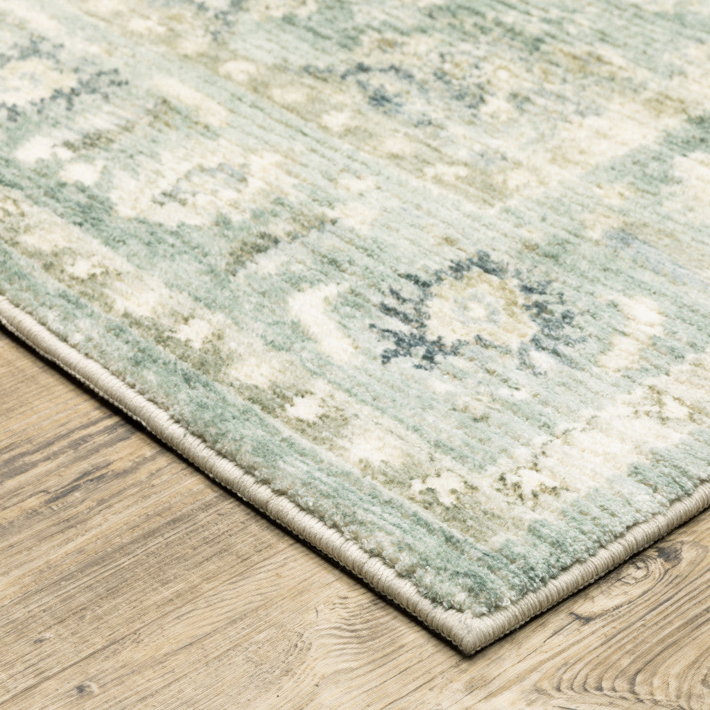 5' X 7' Green And Ivory Oriental Power Loom Stain Resistant Area Rug