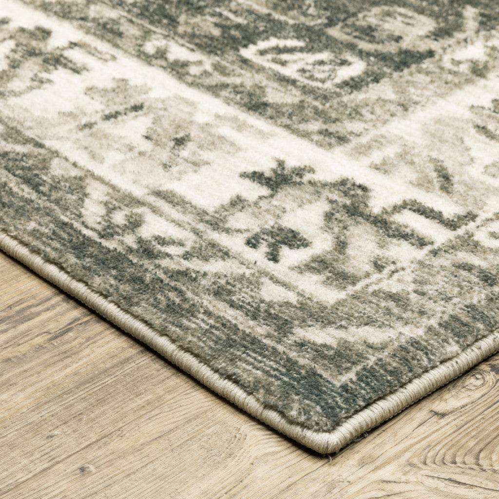 5' X 7' Grey Ivory Tan And Beige Oriental Power Loom Stain Resistant Area Rug