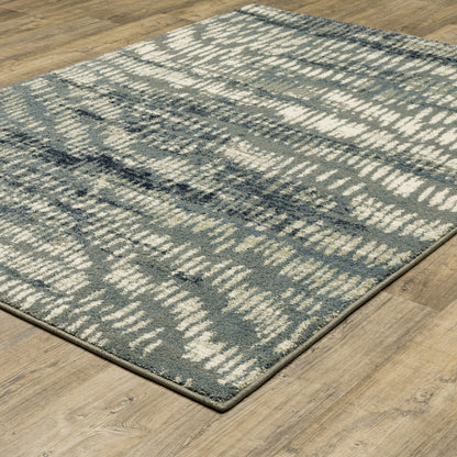 6' X 9' Grey Beige Blue And Light Blue Abstract Power Loom Stain Resistant Area Rug