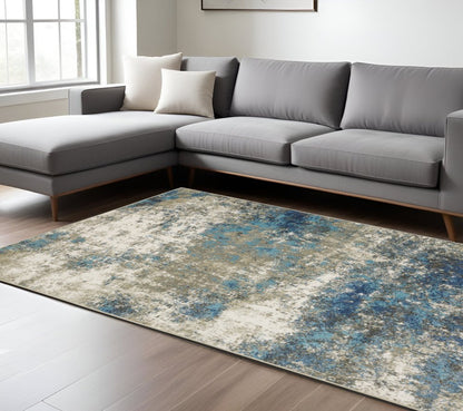 7' X 9' Blue And Beige Abstract Area Rug