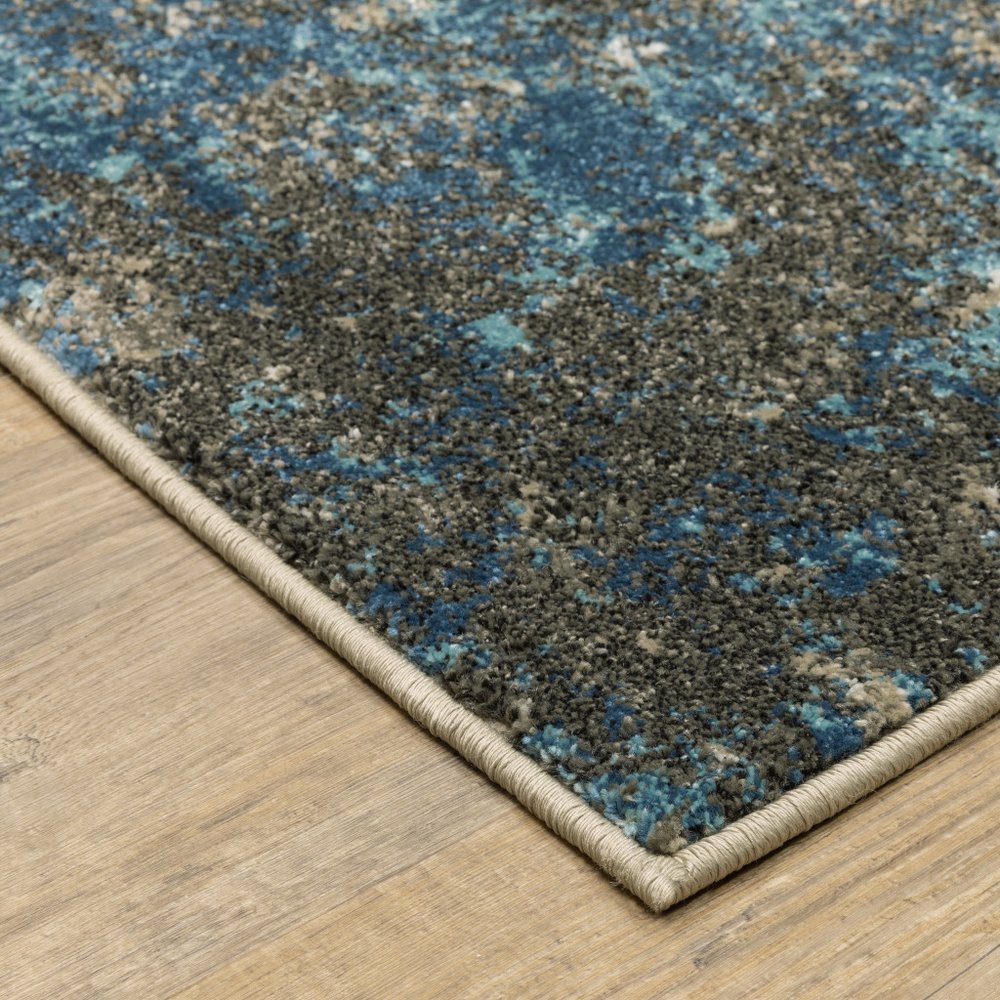 7' X 9' Blue And Beige Abstract Area Rug