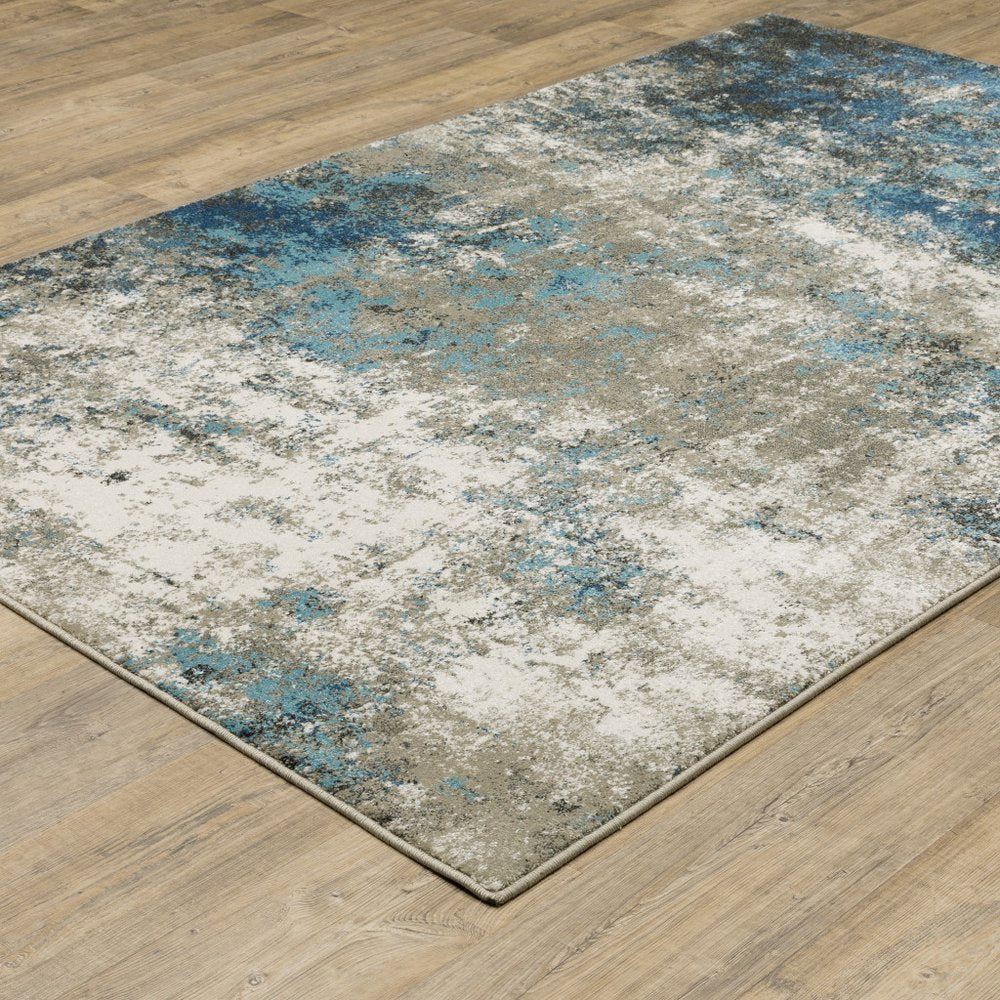 7' X 9' Blue And Beige Abstract Area Rug