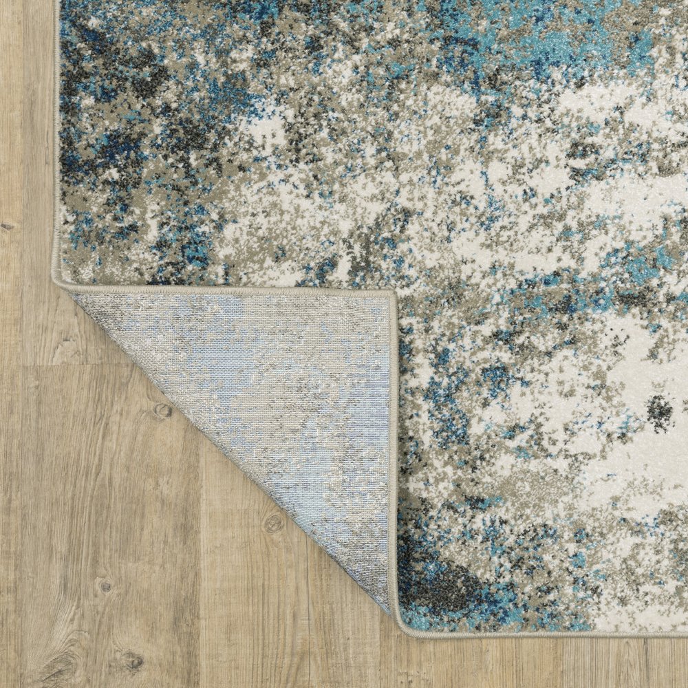 7' X 9' Blue And Beige Abstract Area Rug