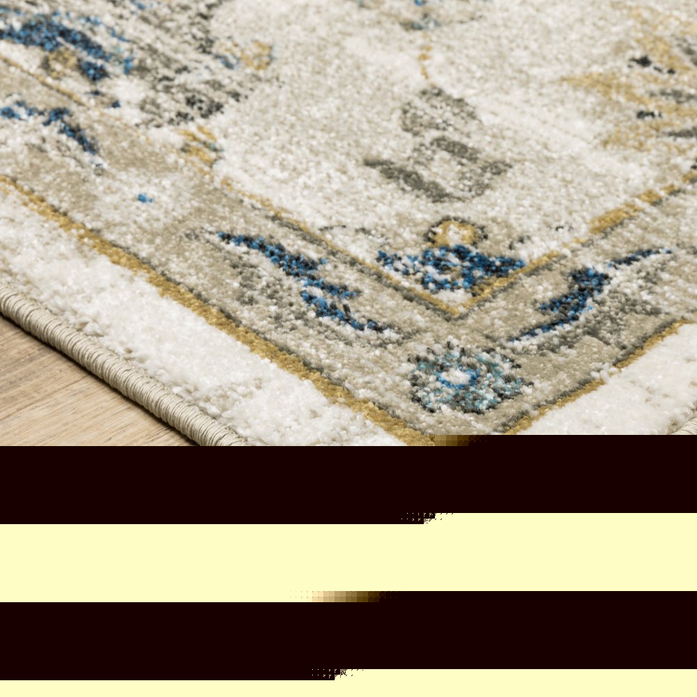5' X 7' Beige Gold Blue And Grey Oriental Power Loom Stain Resistant Area Rug