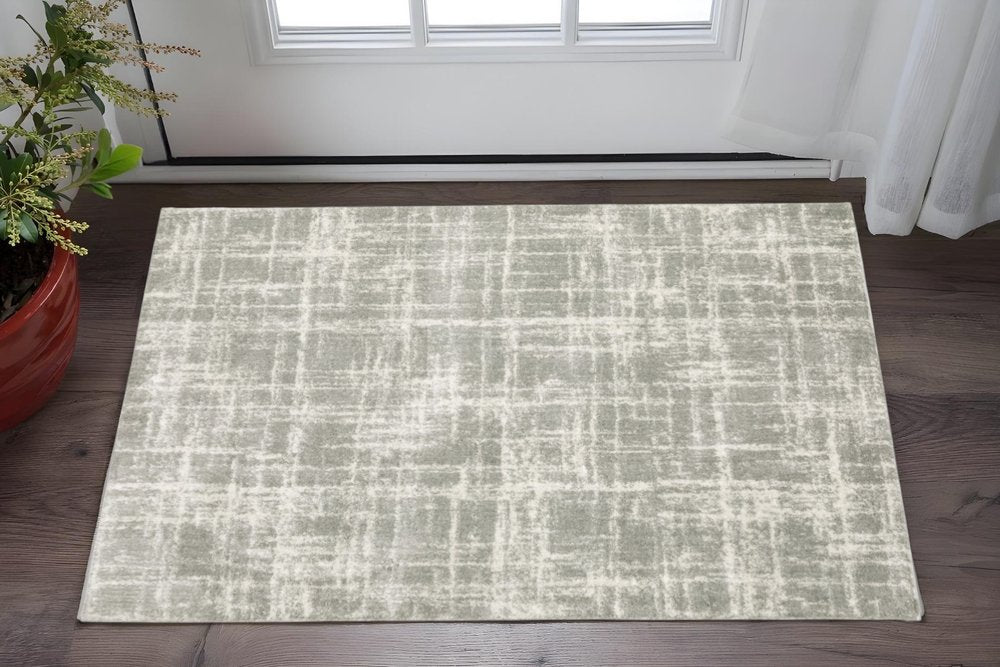 2' X 3' Grey And Ivory Abstract Shag Power Loom Stain Resistant Area Rug