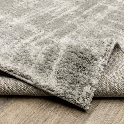 5' X 8' Grey And Ivory Abstract Shag Power Loom Stain Resistant Area Rug