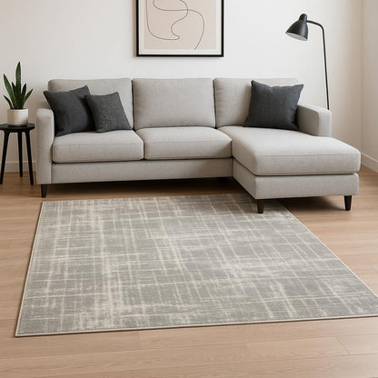 6' X 9' Grey And Ivory Abstract Shag Power Loom Stain Resistant Area Rug