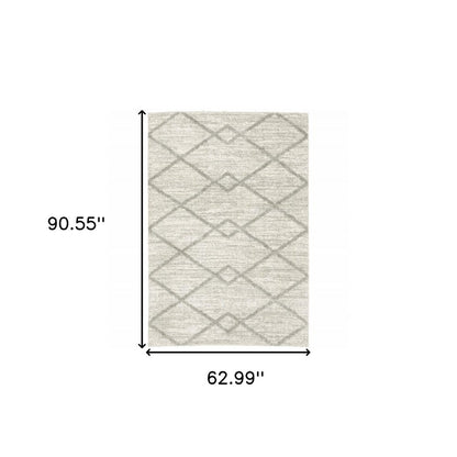 5' X 8' Ivory And Grey Geometric Shag Power Loom Stain Resistant Area Rug