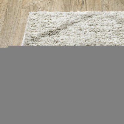 6' X 9' Ivory And Grey Geometric Shag Power Loom Stain Resistant Area Rug