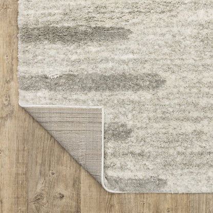 5' X 8' Ivory And Grey Geometric Shag Power Loom Stain Resistant Area Rug