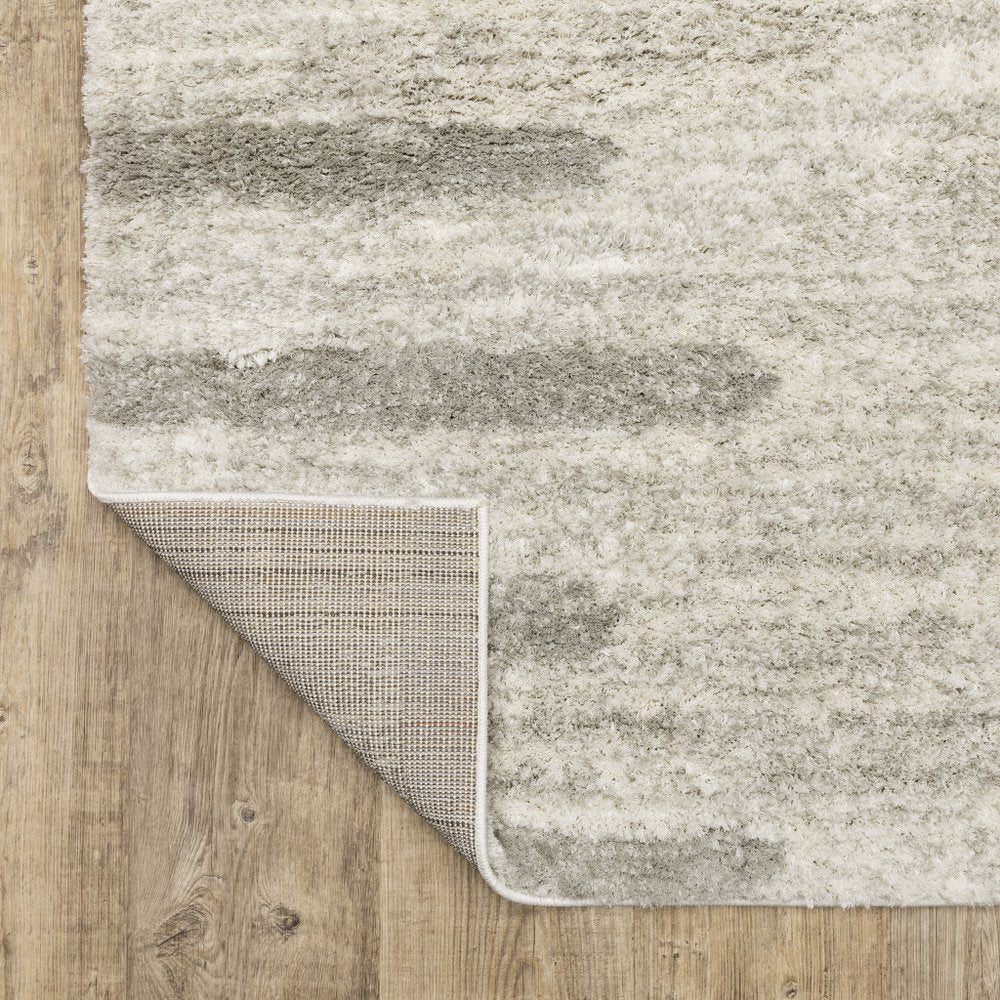 5' X 8' Ivory And Grey Geometric Shag Power Loom Stain Resistant Area Rug