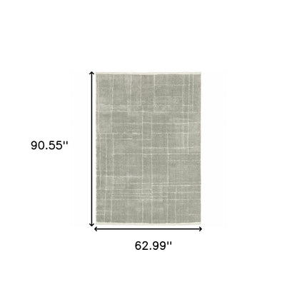 5' X 8' Grey And Ivory Geometric Shag Power Loom Stain Resistant Area Rug