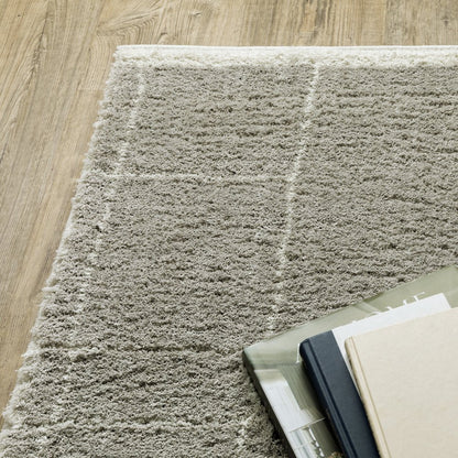 6' X 9' Grey And Ivory Geometric Shag Power Loom Stain Resistant Area Rug